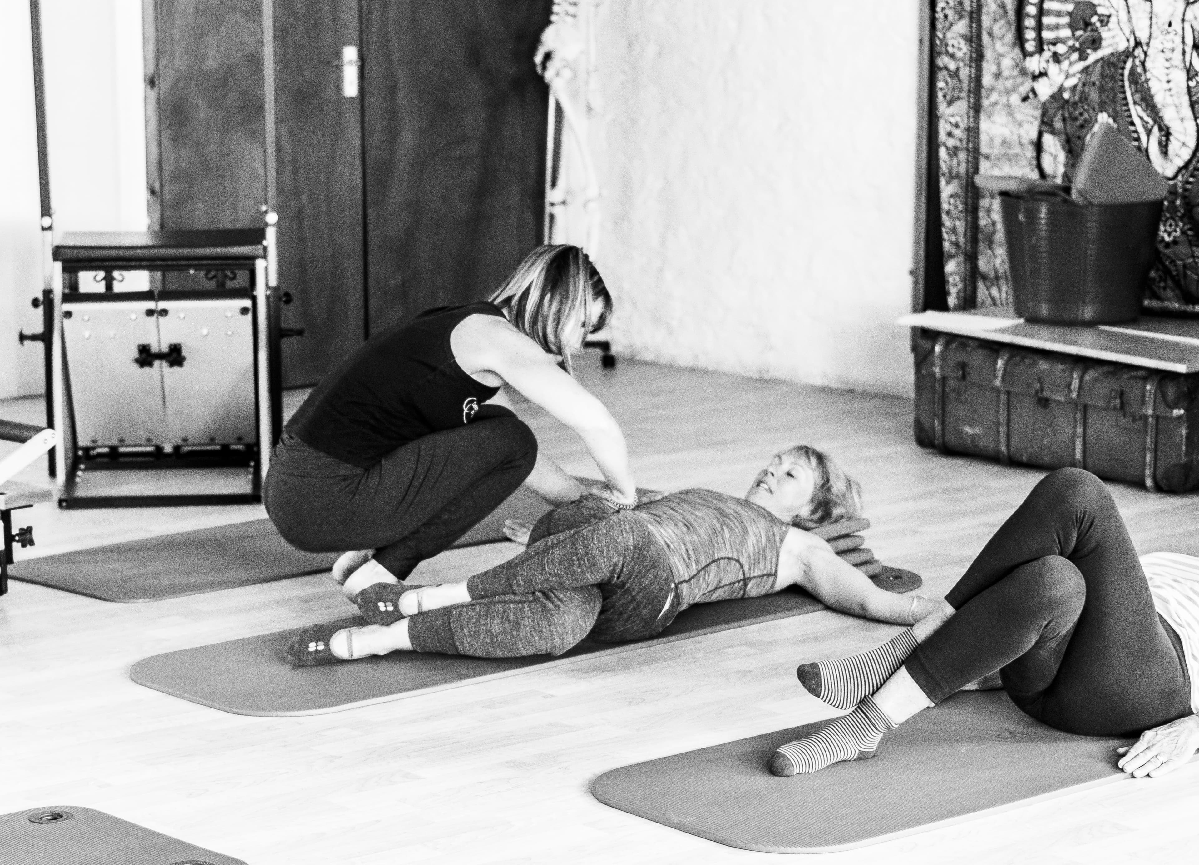 Debbie providing hands-on guidance during a Somatics class in Barnstaple